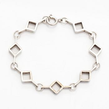 Jorma Laine, a set of two silver pendants, a bracelet and a brooch. Kultateollisuus Oy, Turku 1965-1972.