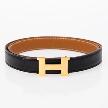 A REVERSIBLE LEATHER BELT, size 90. 2003.