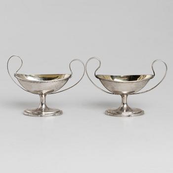 A pair of firt half of the 19th century parcel-gilt silver salt-cellars by an uknown master, one marked HB.