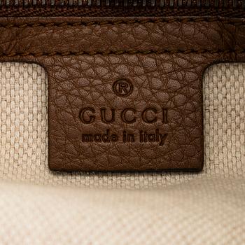 Gucci, a 'Denim Soho Chain Tote' bag.