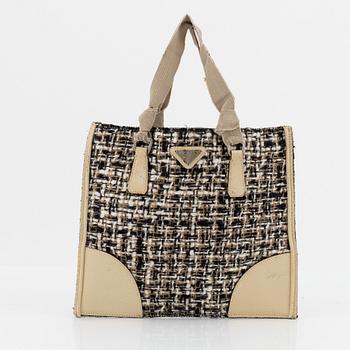 Prada, a tweed and leather bag.