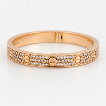 A Cartier 'LOVE' bangle set with round, brilliant-cut diamonds.