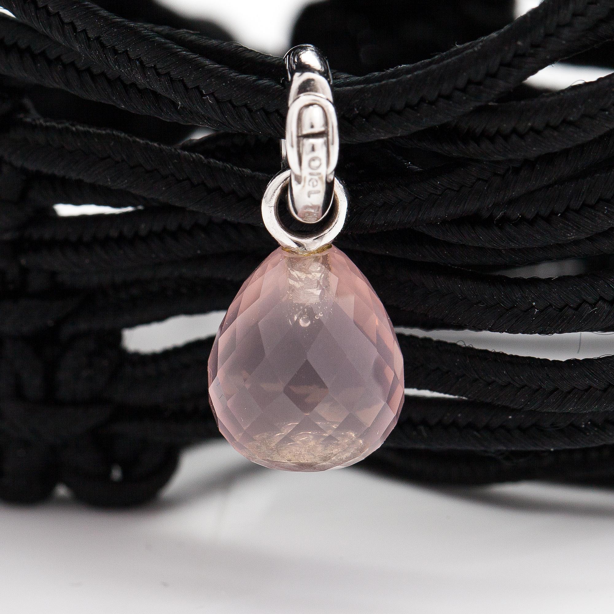 Ole Lynggaard, A satin like band bracelet with an 18K white gold and rose quartz "Sweet drops" pendant.
