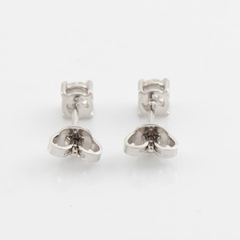 Brilliant cut diamond stud earrings.