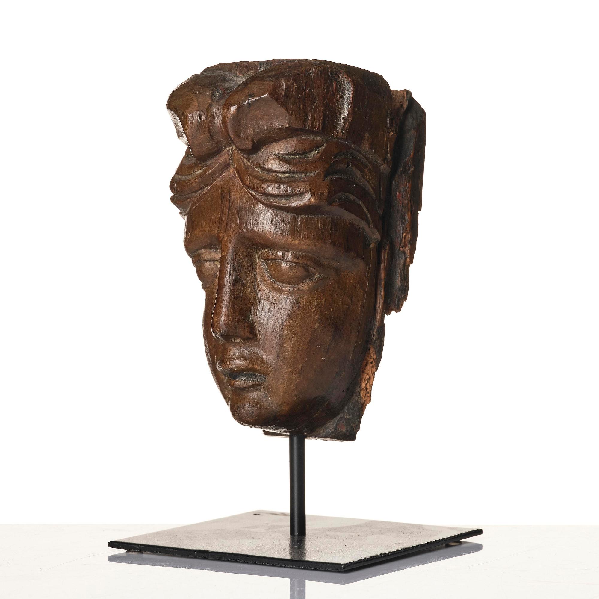 A wooden sculpture presumably Baroque around year 1700.