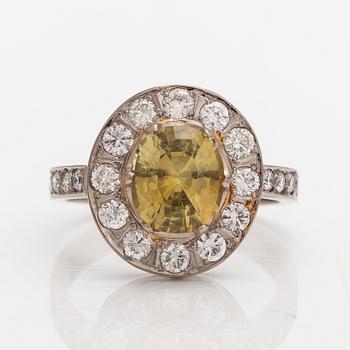 A 14K white gold ring with a chrysoberyl ca. 3.00 ct and diamonds ca. 0.80 ct in total according to certificate.