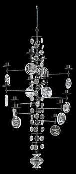 An Erik Höglund iron and cast glass chandelier for twelve candles, Boda Smide, Sweden.