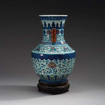 A doucai vase with bamboshaped handles, Qing dynasty, 19th Century, with Qianlong seal mark.