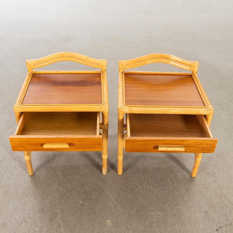 A pair of 1980s Dux rattan bedside tables.