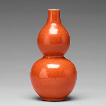 A coral red calebass shaped vase, Qing dynasty with Jiaqing mark (1796-1820).