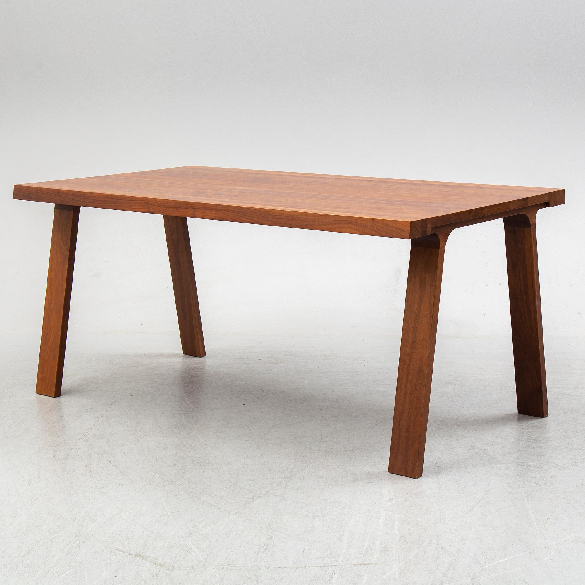 GIJS PAPAVOINE, A walnut 'Doble' dining table from Montis, The Netherlands, 2014.