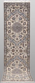 A Nain part silk runner carpet, 311 x 88 cm.