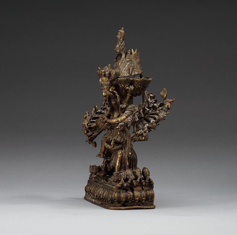 A Tibetian bronze figure, 19th Century.