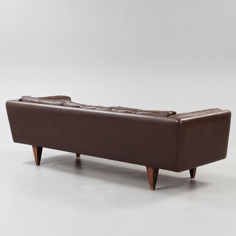 An Illum Wikkelsø three seated brown leather sofa, Michael Laursen, Denmark 1960's.