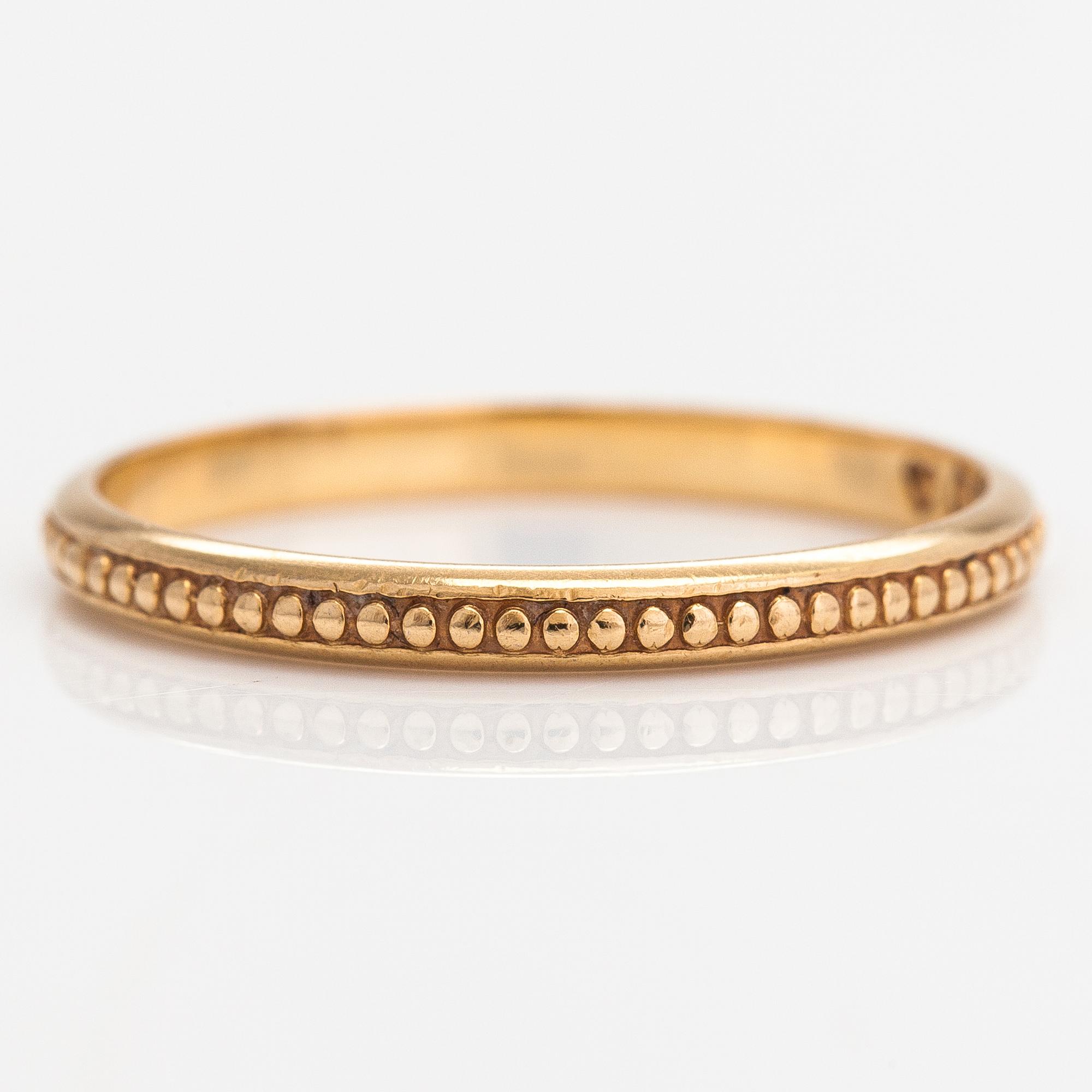 Ring, 18K guld. Kalevala Koru, Helsingfors 1988.