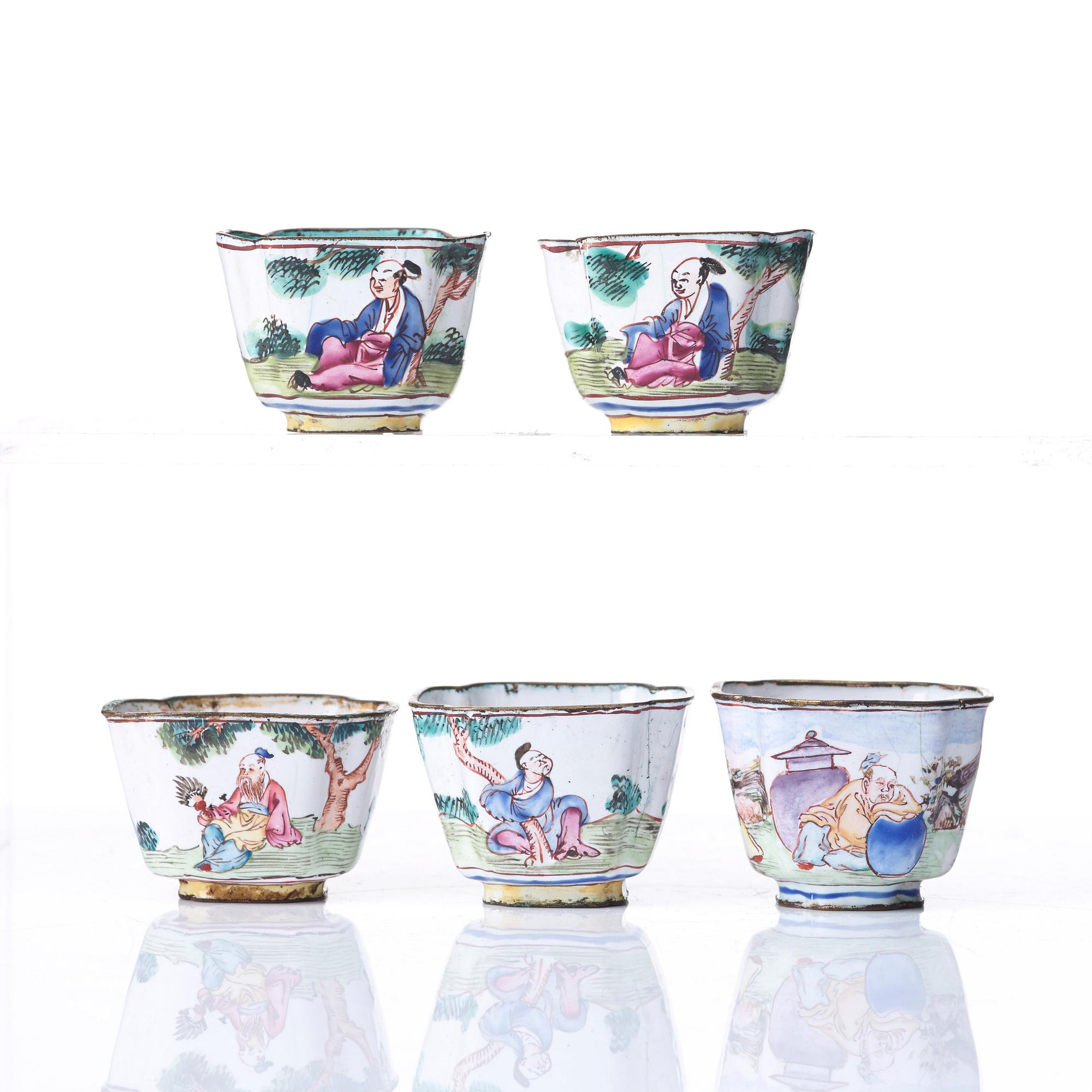 A set of five enamel on copper tea cups and a dish, Qing dynasty, circa 1800.