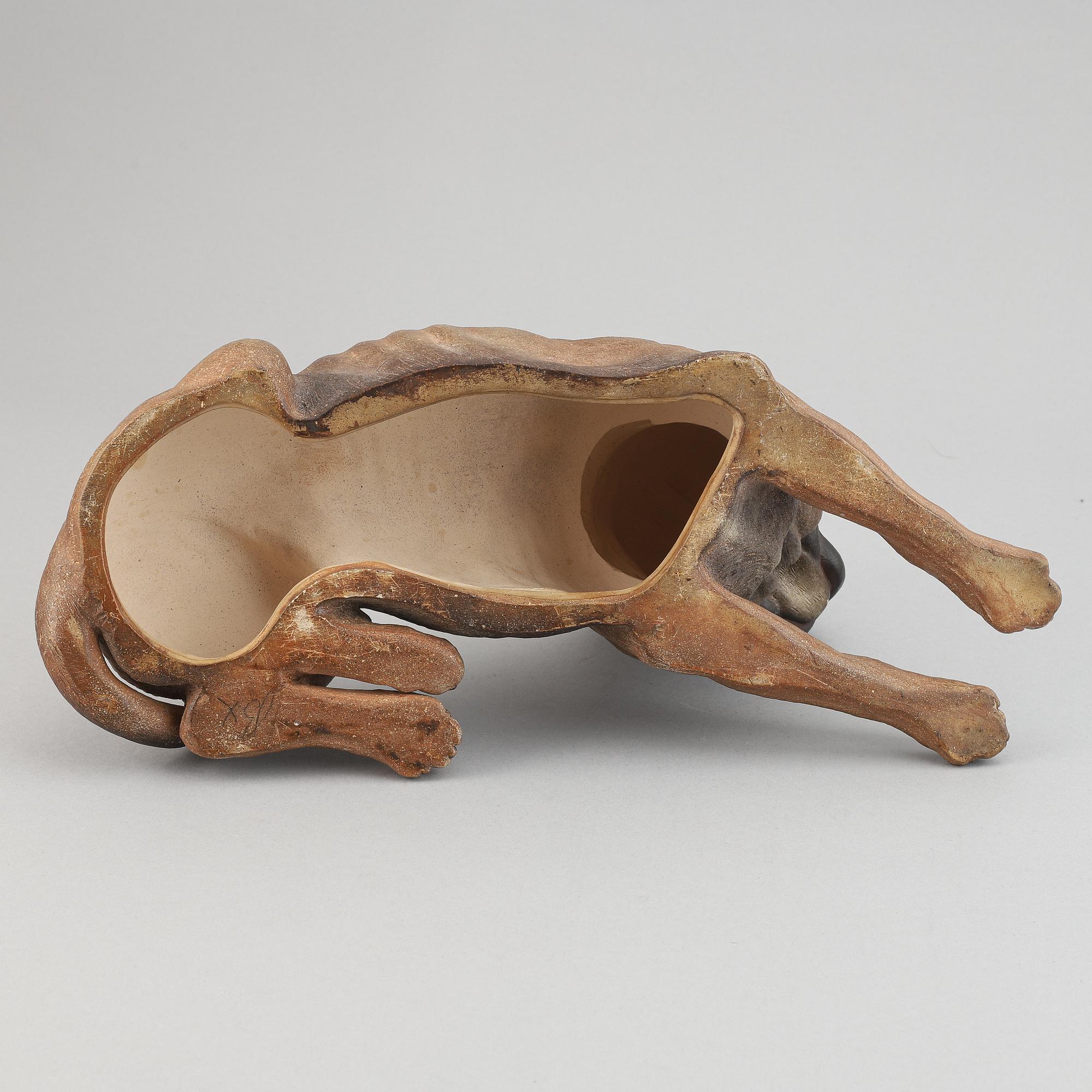 A ceramic sculpture in the shape of a dog, 20th century.