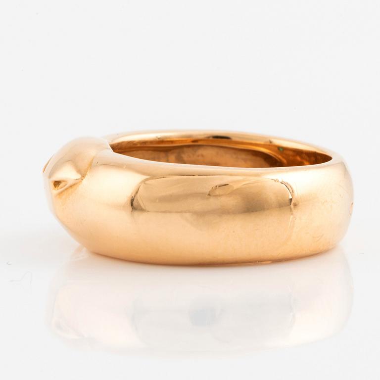 An 18K gold Cartier ring set with a tsavorite.