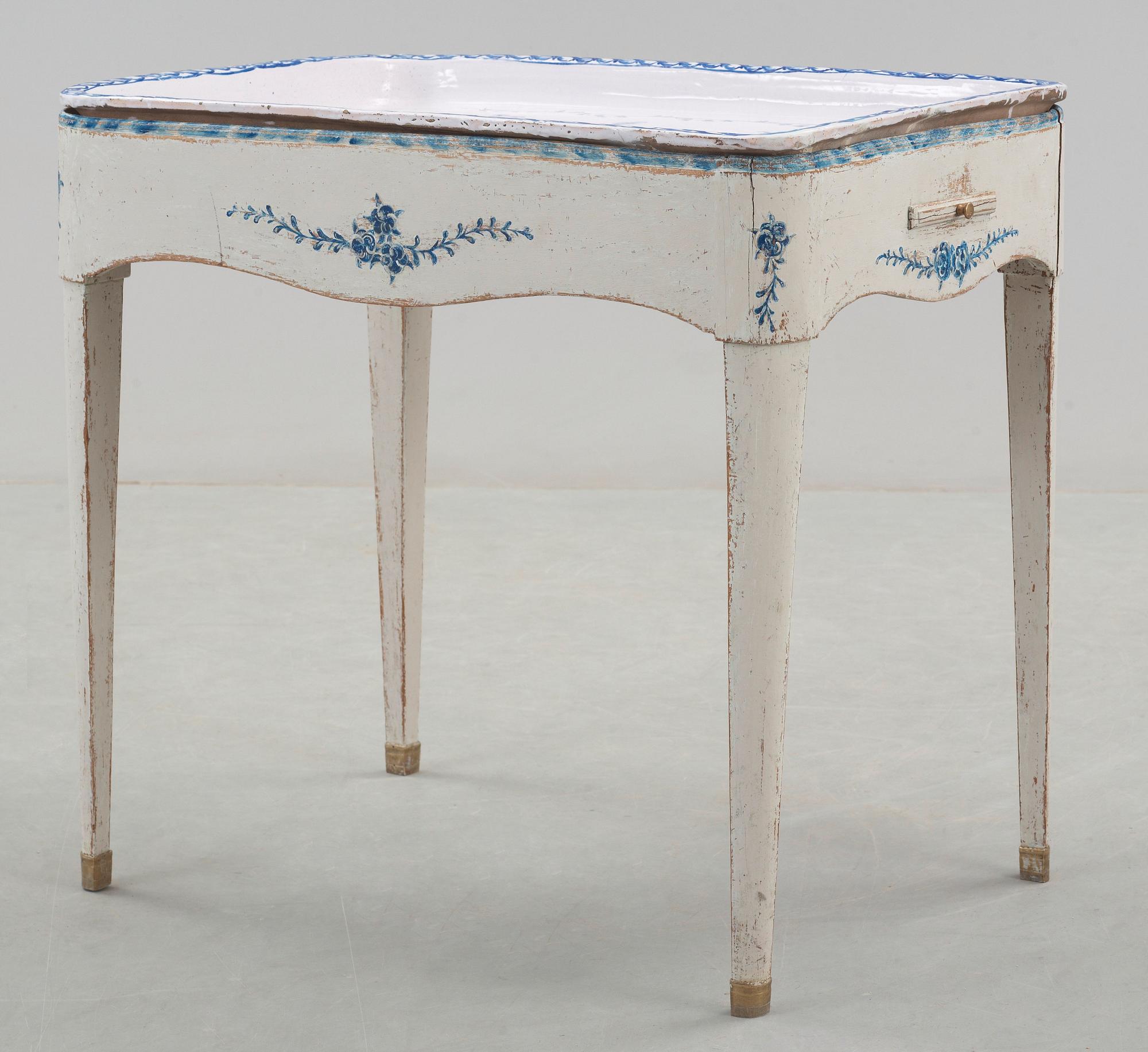 A North European 18th century faience tea table.