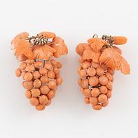 Earrings with coral in the shape of grape clusters.