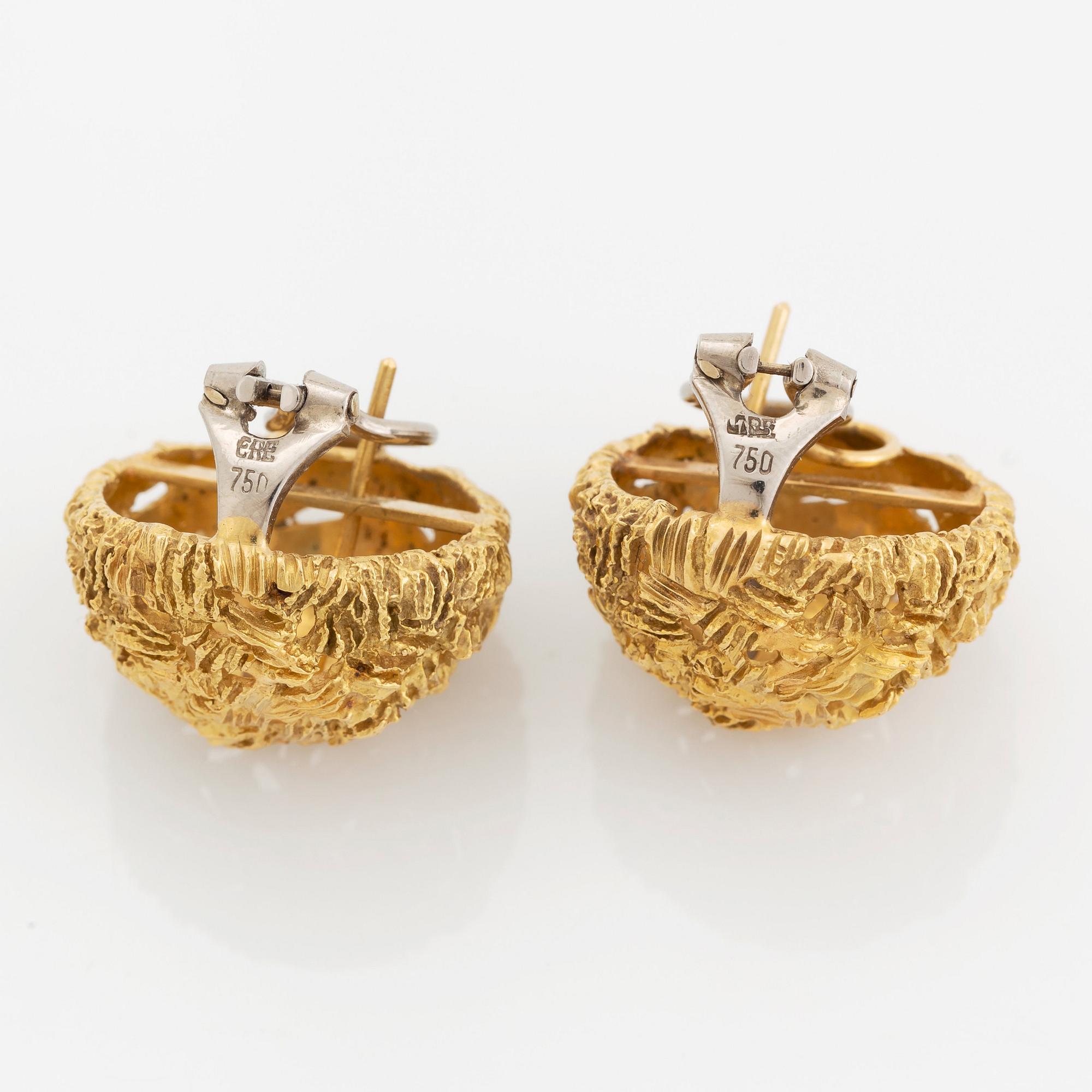 A pair of 18K gold earrings.