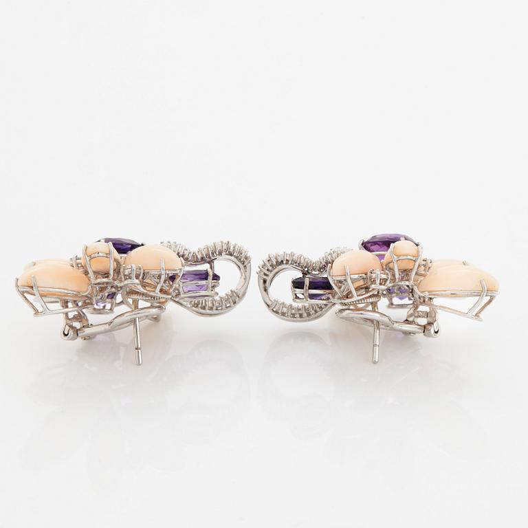 A pair of 18K white gold earrings set with faceted amethyst and coral.