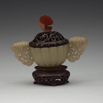 A nephrite cup with wooden cover and stand with silver inlay and quartz finial, Qing dynasty, 19th Century.