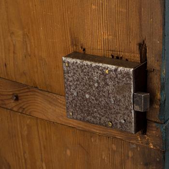 a oainted swedish wood wall cabinet, dated 1807.