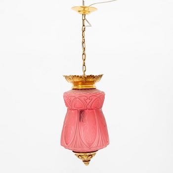 An art noveau glass and brass ceiling lamp from around the year 1900.