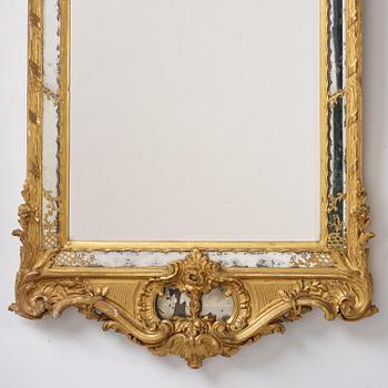 A giltwood rococo mirror, Stockholm, later part 18th century.