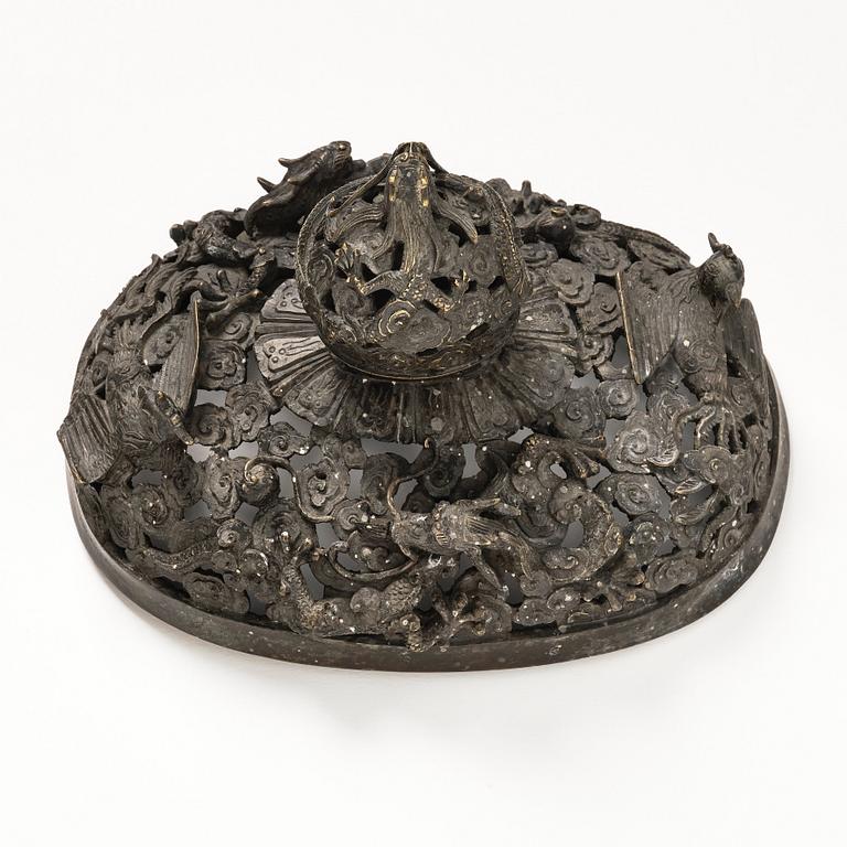 A bronze reticulated incense burner with cover, Qing dynasty (1644-1912).