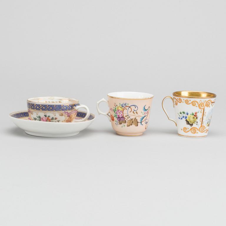 A Russian 19th century Popoff porcelain cup with saucer and two cups.