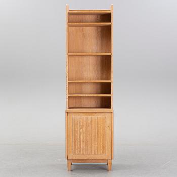 An oak book case with a cabinet, second half of the 20th Century.