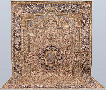 A Kirman Laver carpet, 'Millefleur', approx. 410 x 296 cm.