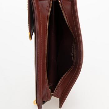 Must de Cartier bag clutch with accessories.