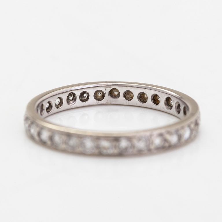 An 18K white gold eternity ring with brilliant-cut diamonds totalling approximately 0.60 ct.