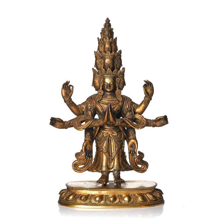 A Tibeto-Chinese gilt bronze figure of Avalokiteshvara Ekasdashamukra, 19th century.