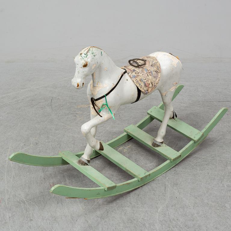 A wooden rocking horse from the early 20th century.