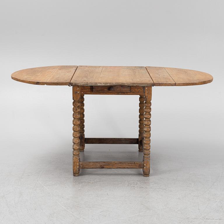 A pine gate-leg table, 18th/19th Century.