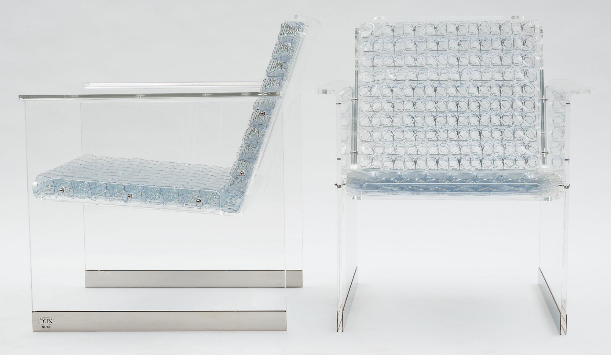 A pair of Arne Rickardt armchairs, 'Pascal', Dux 2002.