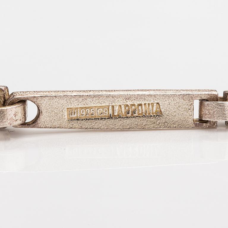 Lapponia, A necklace, bracelet and a pair of earrings made of sterling silver.