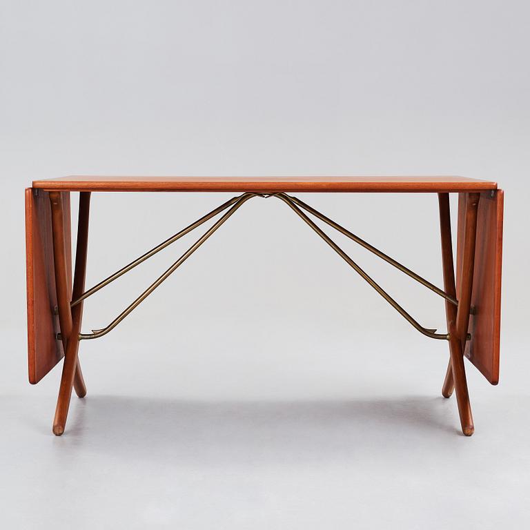 Hans J. Wegner, a teak, beech and brass dining table model "AT-314", for Andreas Tuck, Denmark 1950-60's.