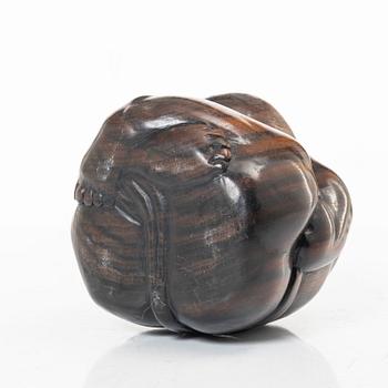 A portable buddhist altar and a figure of 'Weeping Buddha', Japan and Indonesia.