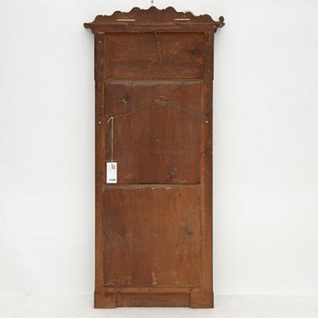 A Swedish Empire mirror with a console table, first half of the 19th Century.