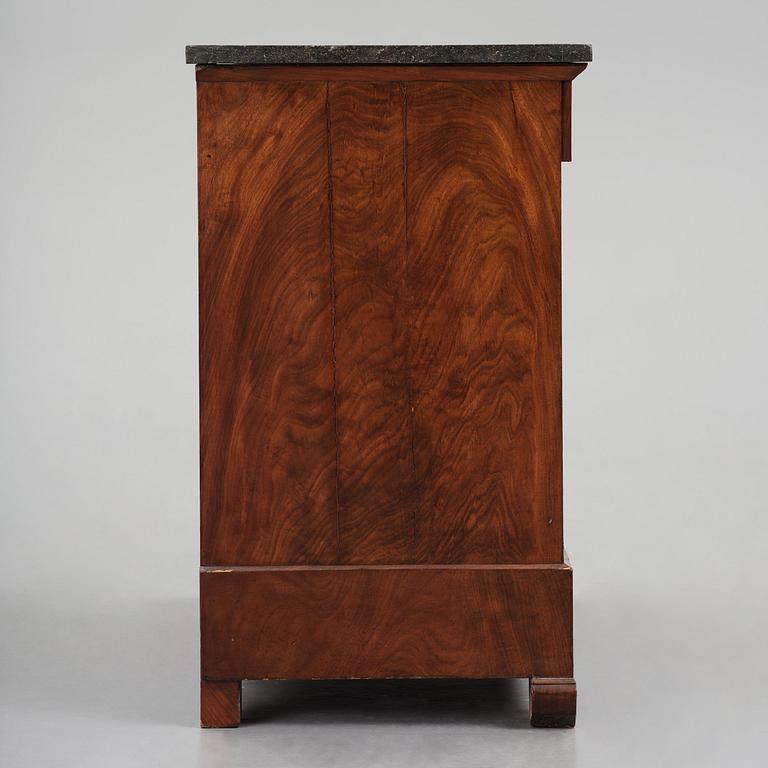 A French Empire mahogany commode, early 19th century.