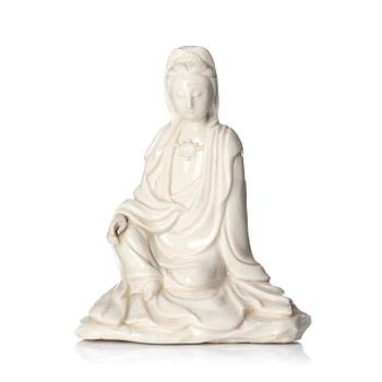1000. A blanc de chine figure of a seated Guanyin, 18th/19th century.