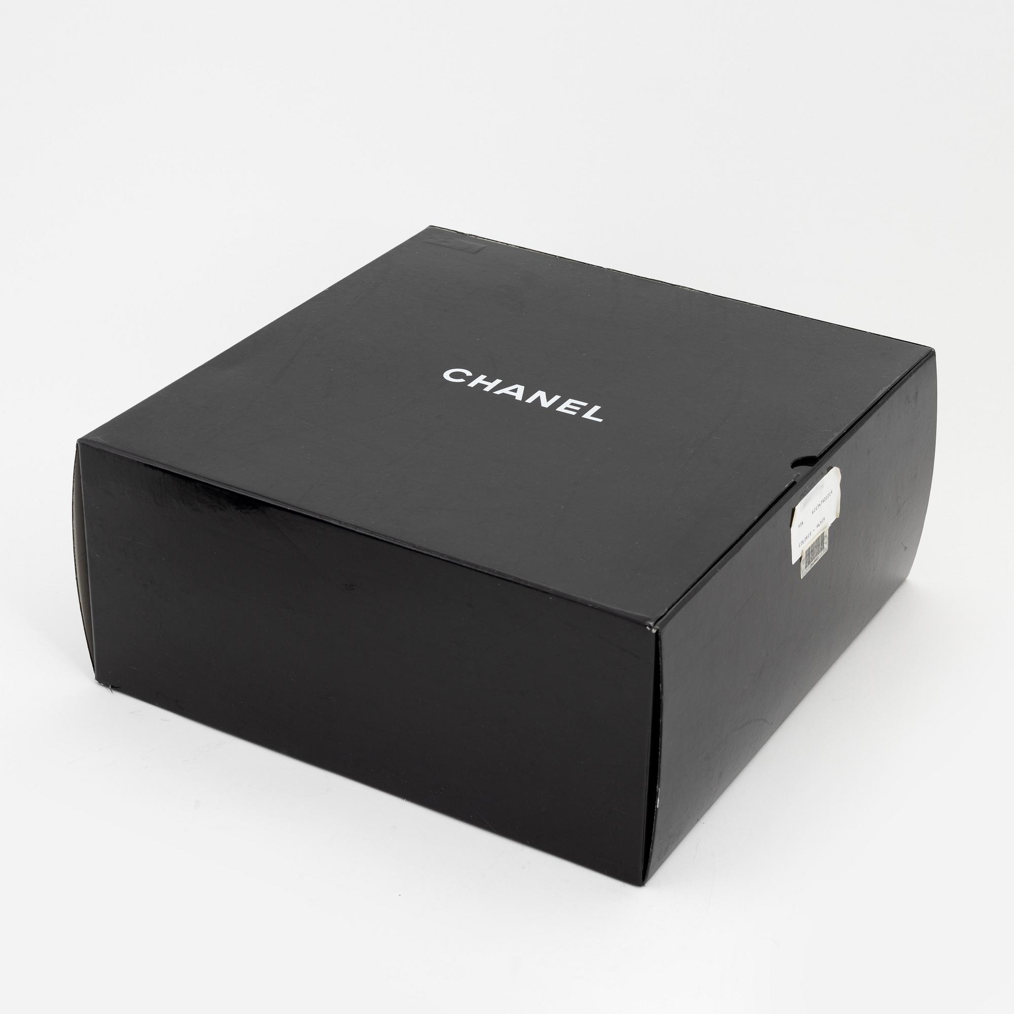 Chanel a black leather and gold hardware 'Maxi flapbag', 1991-1994.