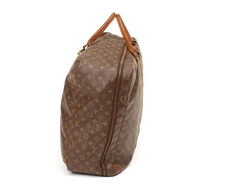 A monogram canvas softsided suitcase by Louis Vuitton.