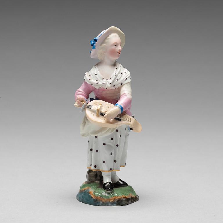 A porcelainfigure of a female musician, "Höchst mark", circa 1900.