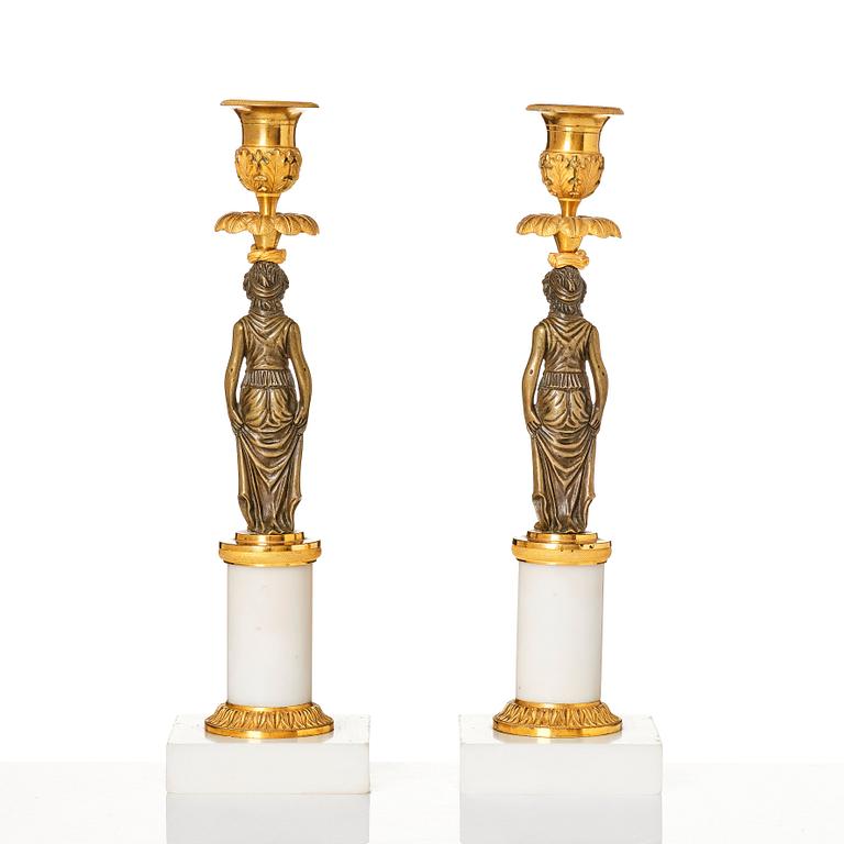 A pair of late Gustavian ormolu, patinated bronze, and marble candlessticks attributed to F. L. Rung (1758-1837).